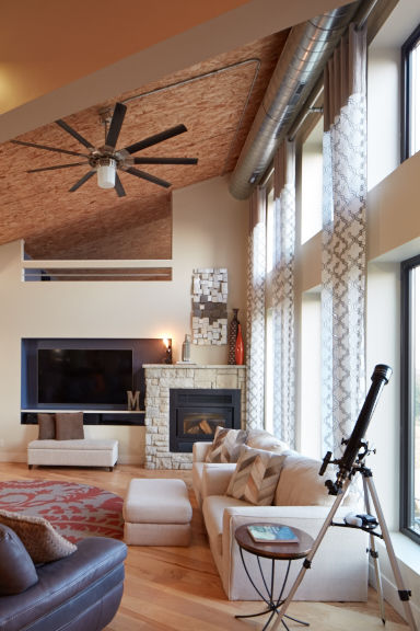 Modern ranch home with exposed particleboard ceiling